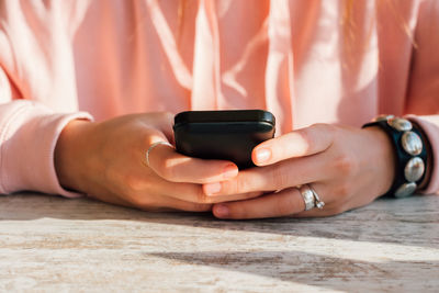 Close-up of man using mobile phone