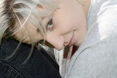 Close-up of young woman sleeping on bed