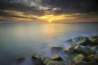 Scenic view of sea against sky during sunset