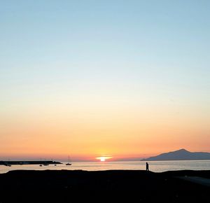 Scenic view of sea against sky at sunset