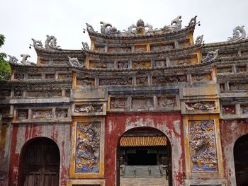 Low angle view of temple against building