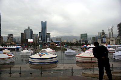 Panoramic view of modern buildings in city against sky