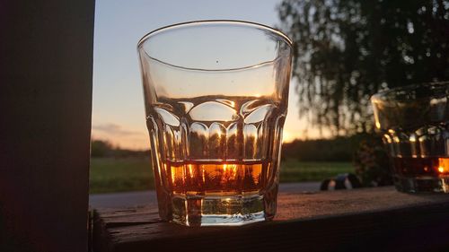 Close-up of glass whith whiskey on table