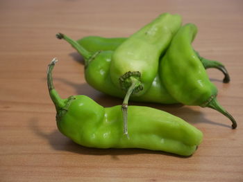 Close-up of green chili pepper on table