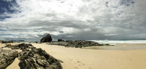 Scenic view of beach against sky