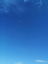 Low angle view of airplane flying in sky