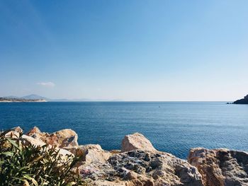 Scenic view of sea against blue sky