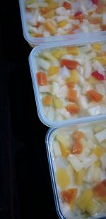 High angle view of chopped fruit in glass container
