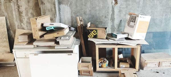 Stack of books on table against wall