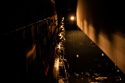 Illuminated lights on wall at night