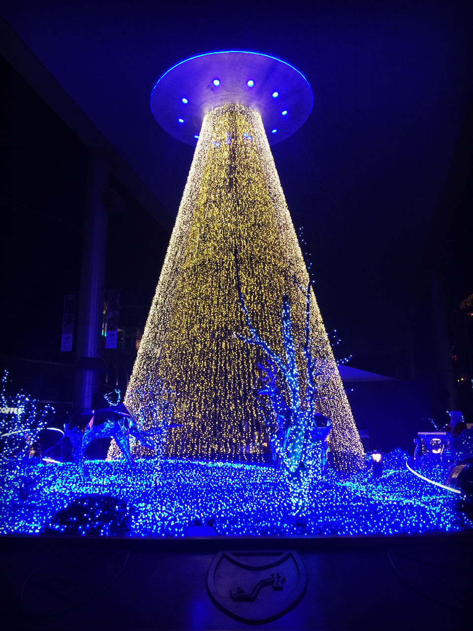 illuminated, night, blue, lighting equipment, indoors, light - natural phenomenon, glowing, water, decoration, built structure, architecture, christmas decoration, light, pattern, motion, low angle view, christmas lights, long exposure, city, electric light