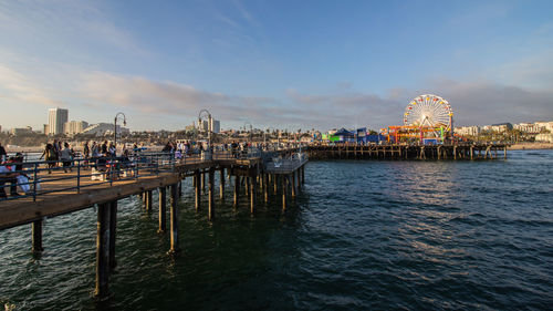 View of pier in city at waterfront