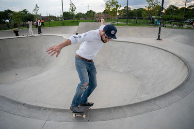 Full length of boy skateboarding on skateboard