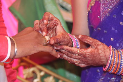 Midsection of woman holding hands