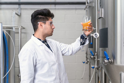 Side view of male scientist working in laboratory