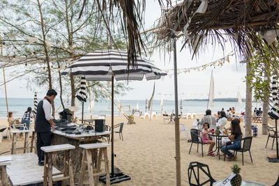 People in restaurant at beach