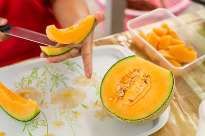 High angle view of fruits in plate on table