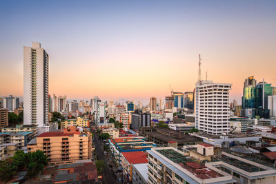 Cityscape against sky during sunset