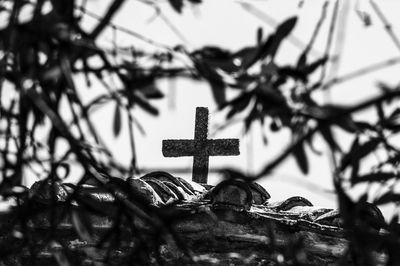 Close-up of cross on cemetery