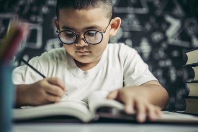 Portrait of boy with book