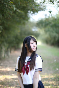 Young woman standing at park