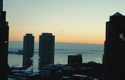 View of skyscrapers at sunset
