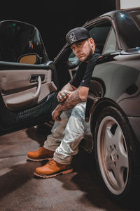 Portrait of man sitting in car