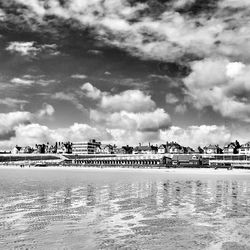 View of beach against cloudy sky