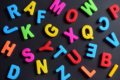 High angle view of colorful alphabets on table