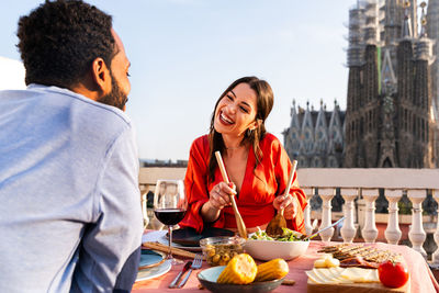 Portrait of smiling friends having food at restaurant