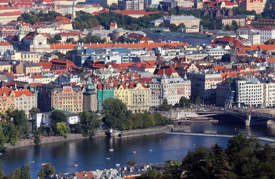 High angle view of river amidst buildings in city