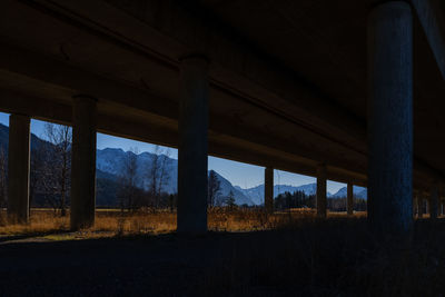 Low angle view of bridge on field against sky