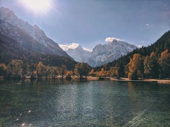 Scenic view of lake and mountains against sky