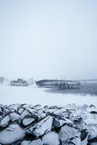 Scenic view of sea against clear sky during winter