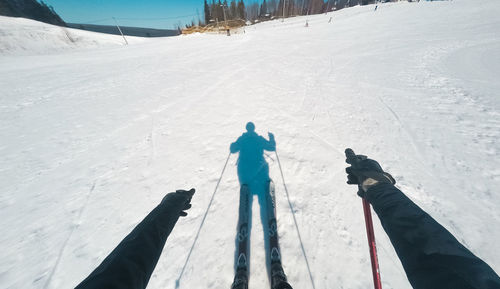 People skiing on snow covered land