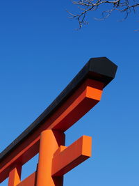 Red torii gate and clear blue sky