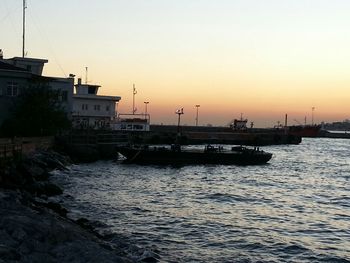 Boat in sea at sunset