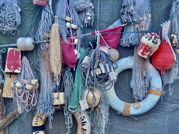 Close-up of fishing net hanging on rope