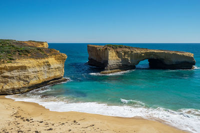 Scenic view of sea against clear blue sky