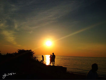 Scenic view of sea at sunset