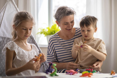 Mother playing with toys at home