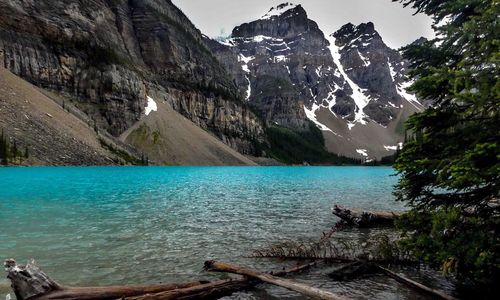 Scenic view of lake and mountains against sky