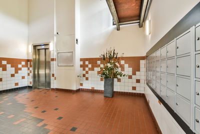 Rear view of man walking in corridor