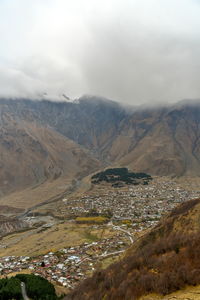 Aerial view of valley and mountains against sky