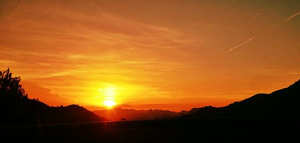 Scenic view of mountains at sunset