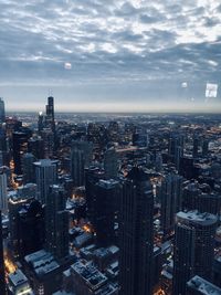 High angle view of modern buildings in city against sky