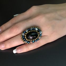 Close-up of human hand against black background