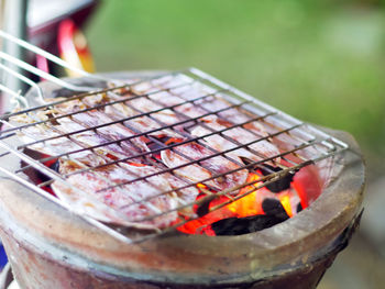 Close-up of meat on barbecue grill