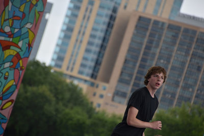 Portrait of teen boy downtown 