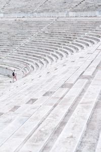 High angle view of man walking on steps at amphitheater